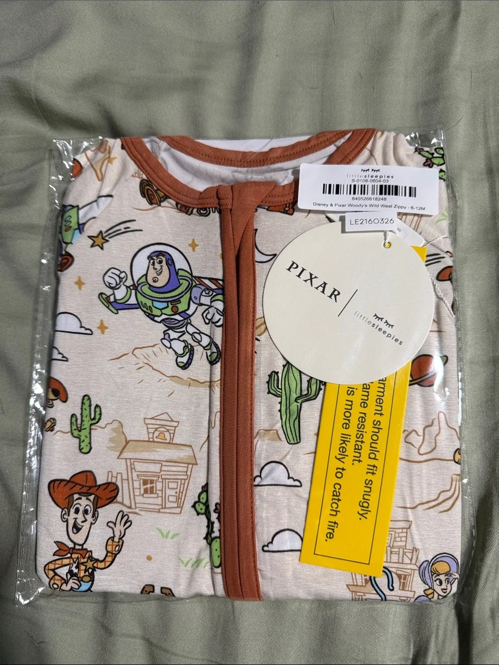 Little Sleepies Toy Story One-Piece Footie in Cream and Brown Trim